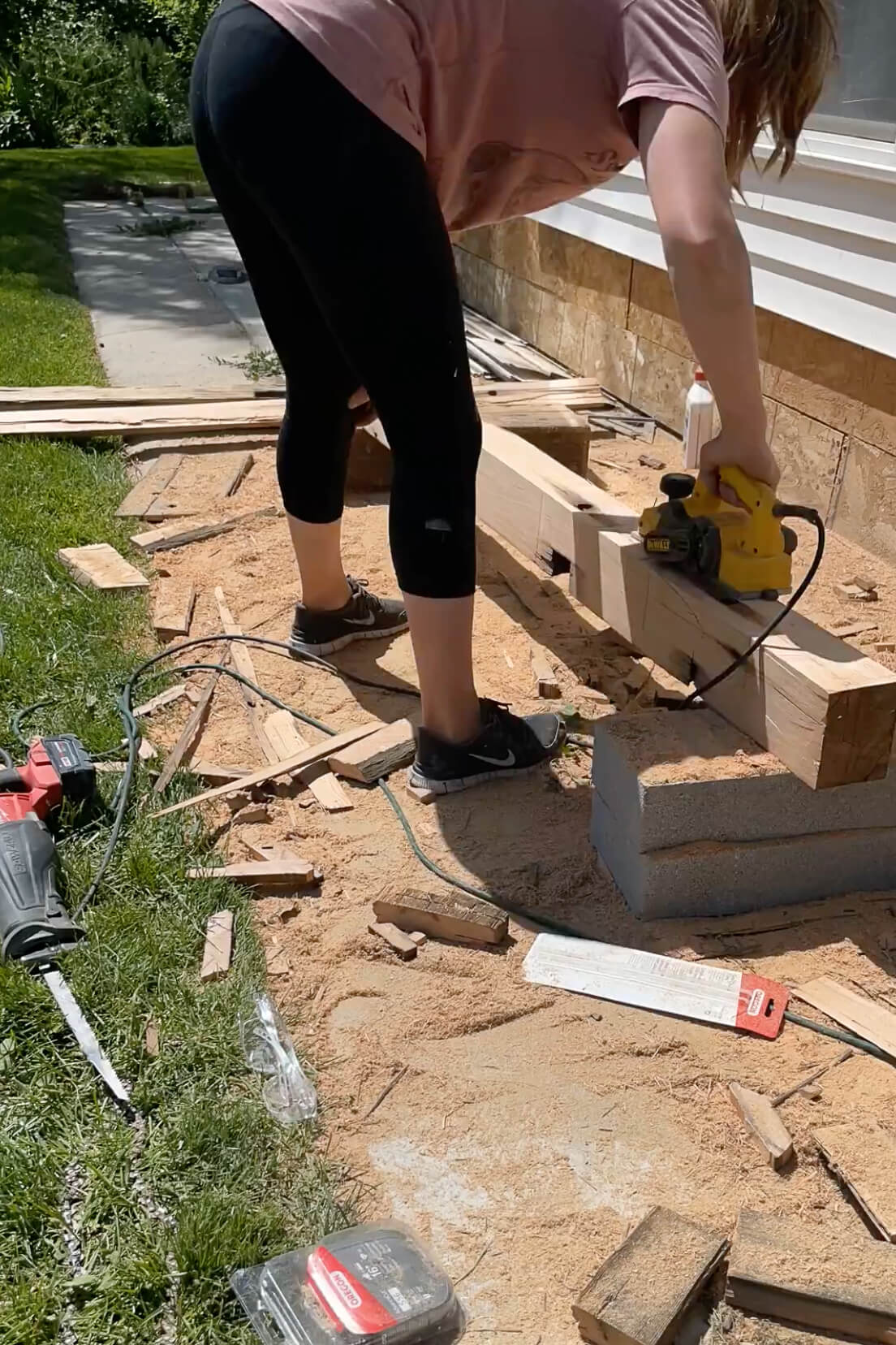 Planing and sanding an old mantle to make it smaller and thinner.